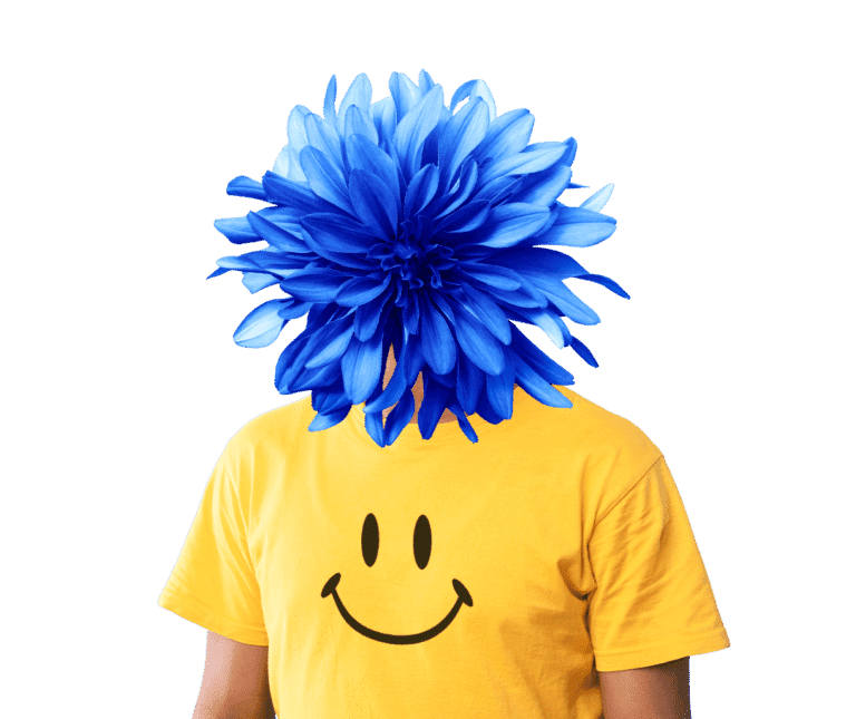 a person wearing a yellow smiley face shirt and his head is replaced with a large blue flower.